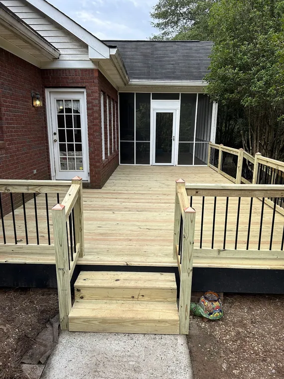 New wood deck with steps and railing on a brick home in Griffin GA