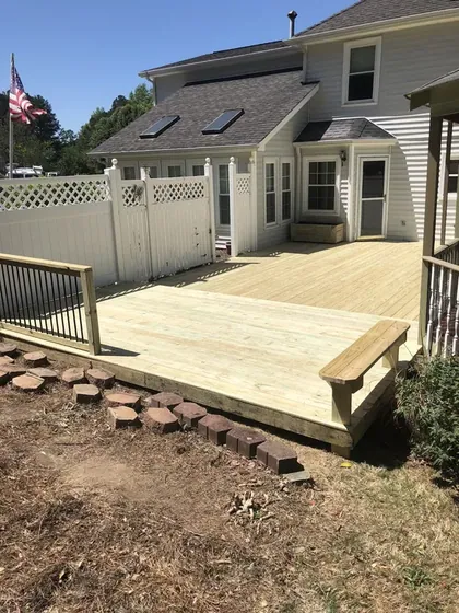 New wood deck built off the back of a home