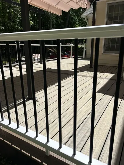 Close up of deck railing with black metal balusters
