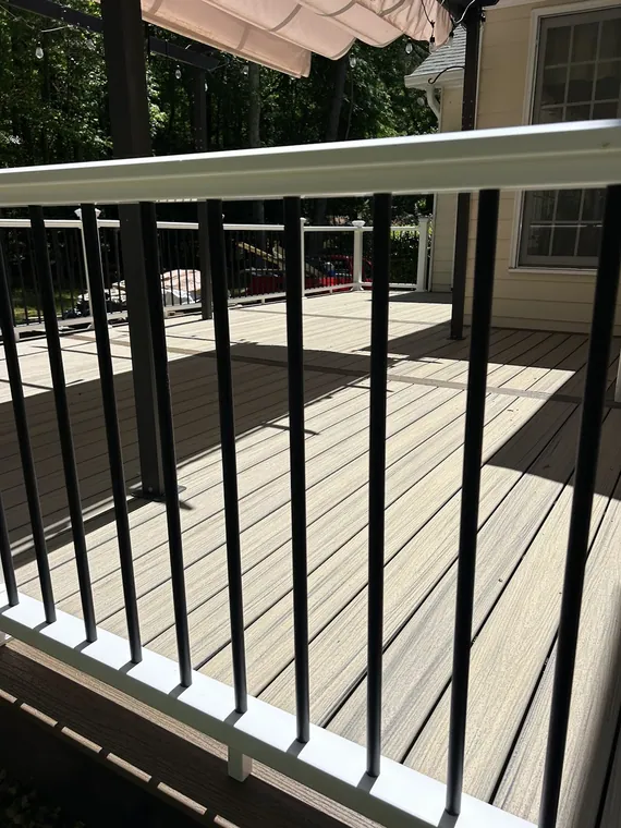 Close up of deck railing with black metal balusters