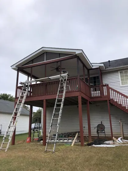 Two storey deck under construction with ladders in place