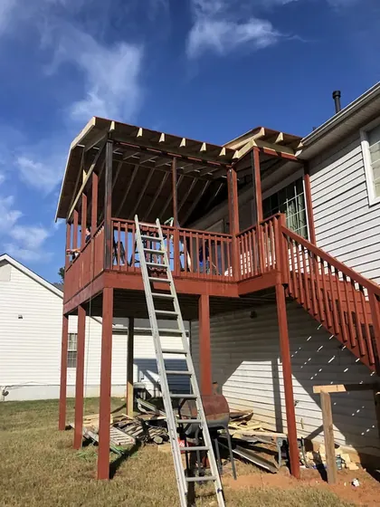 Deck framing and posts going up